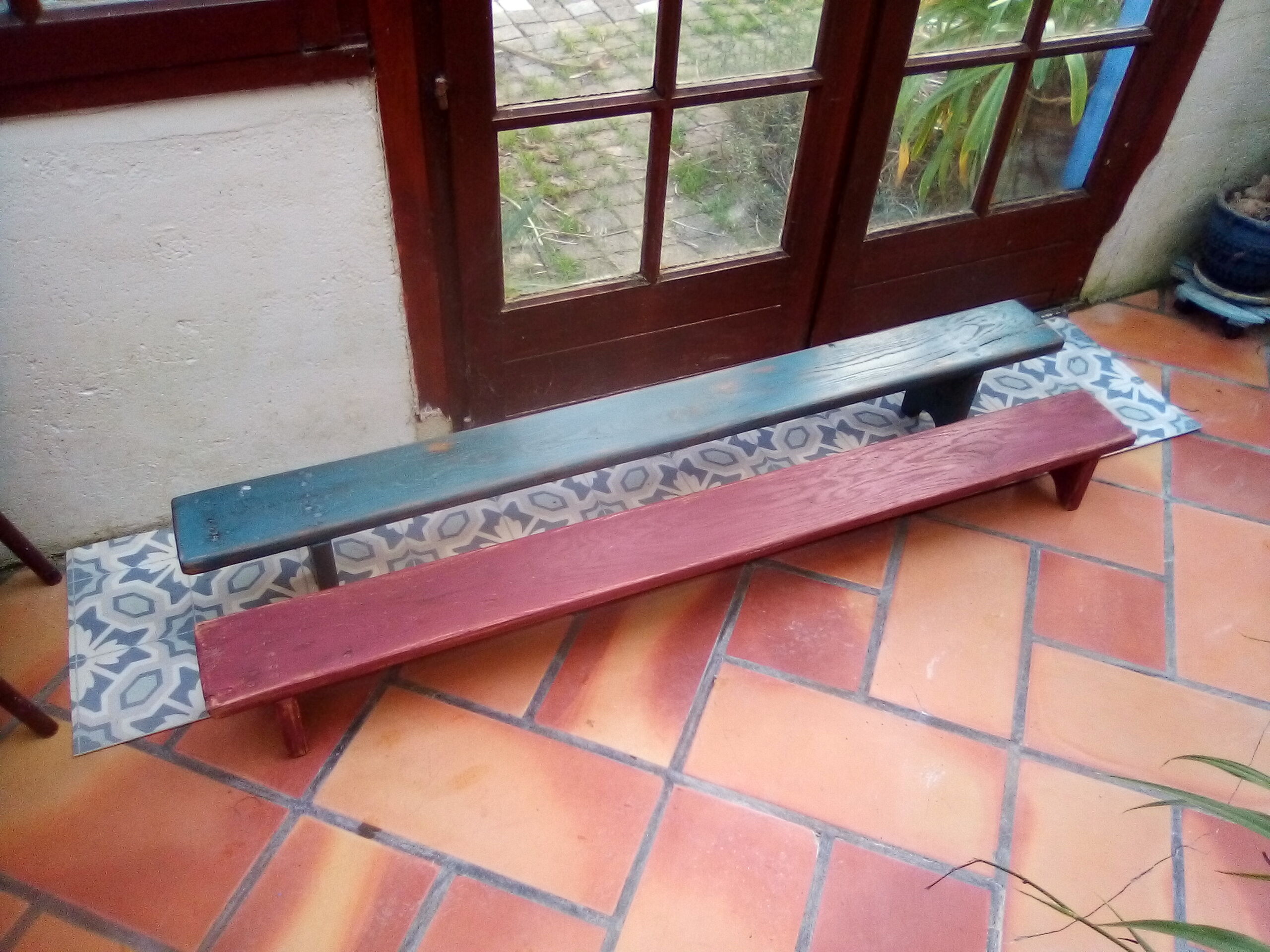 Low bench rests feet in patinated wood