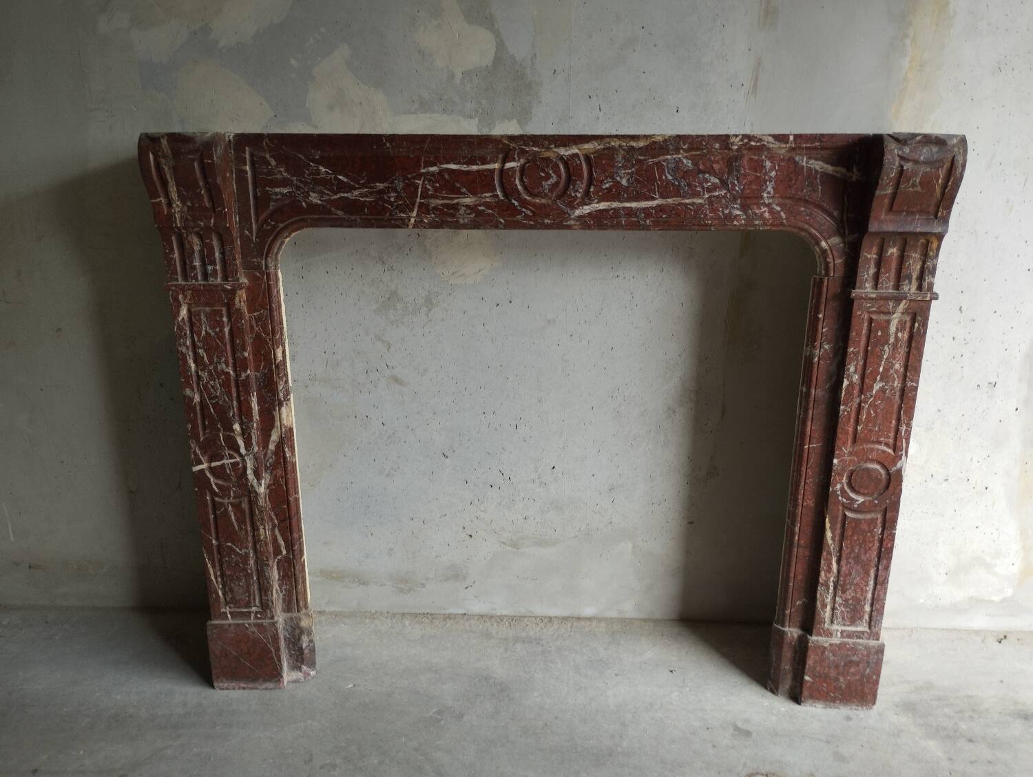Old Louis XV red marble fireplace