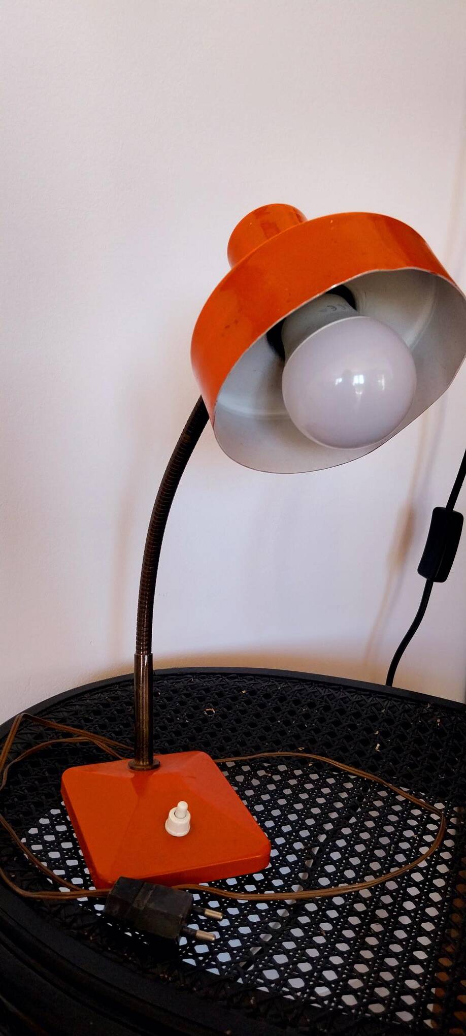 Orange metal lamp from the 60s and 70s.