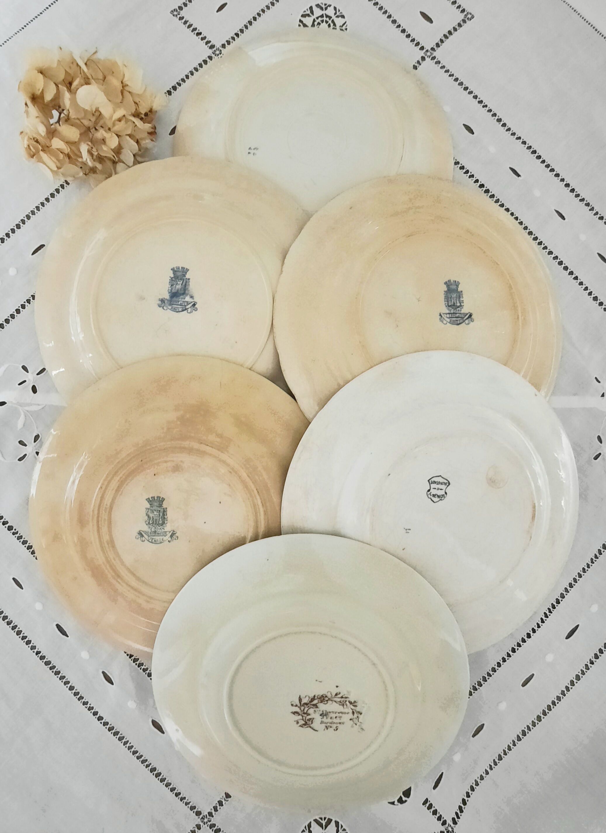 Old flat plates mismatched in earthenware