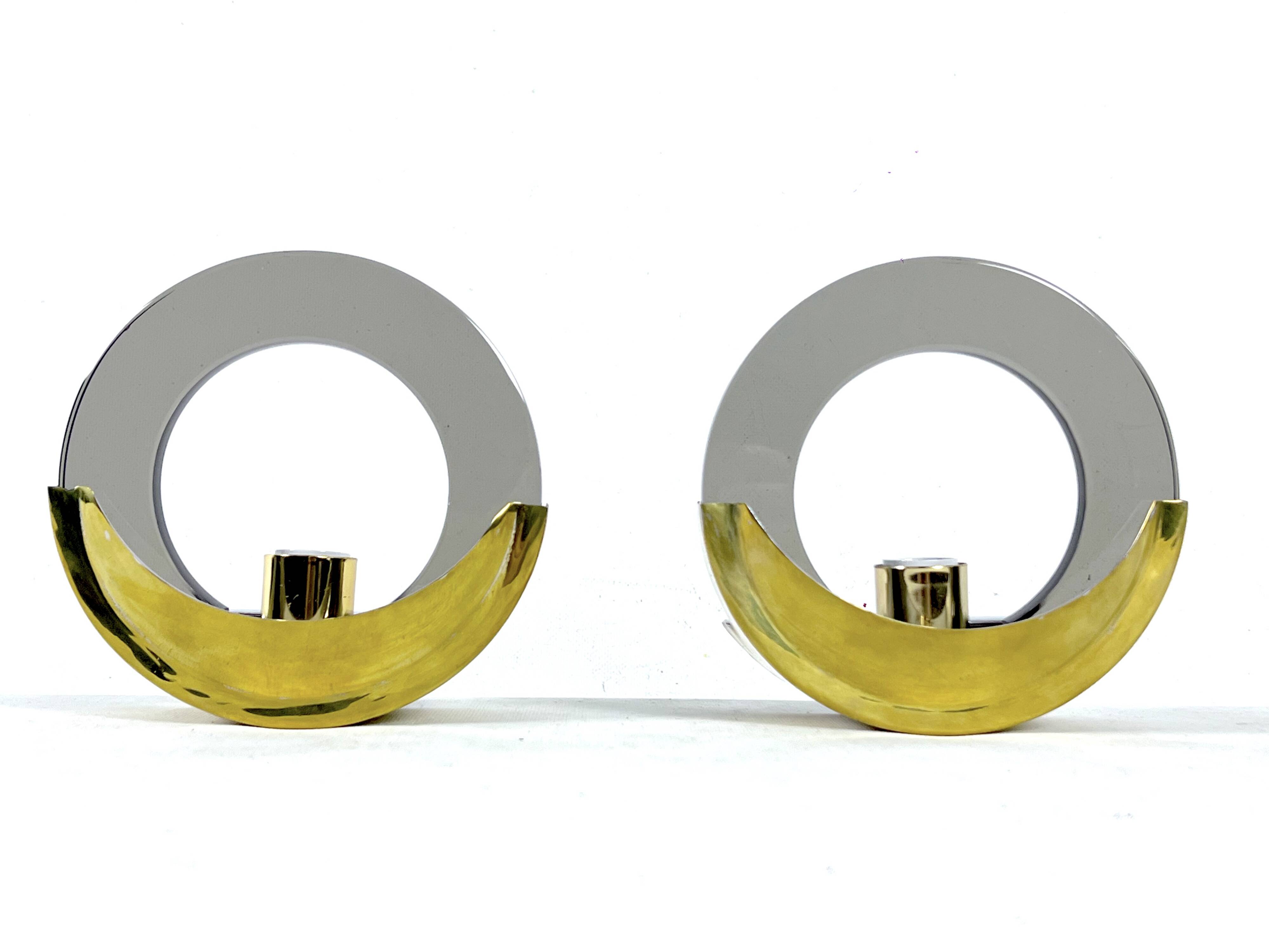 Mid-Century Modern pair of brass and thick smoked glass sconces. Italy 1970s