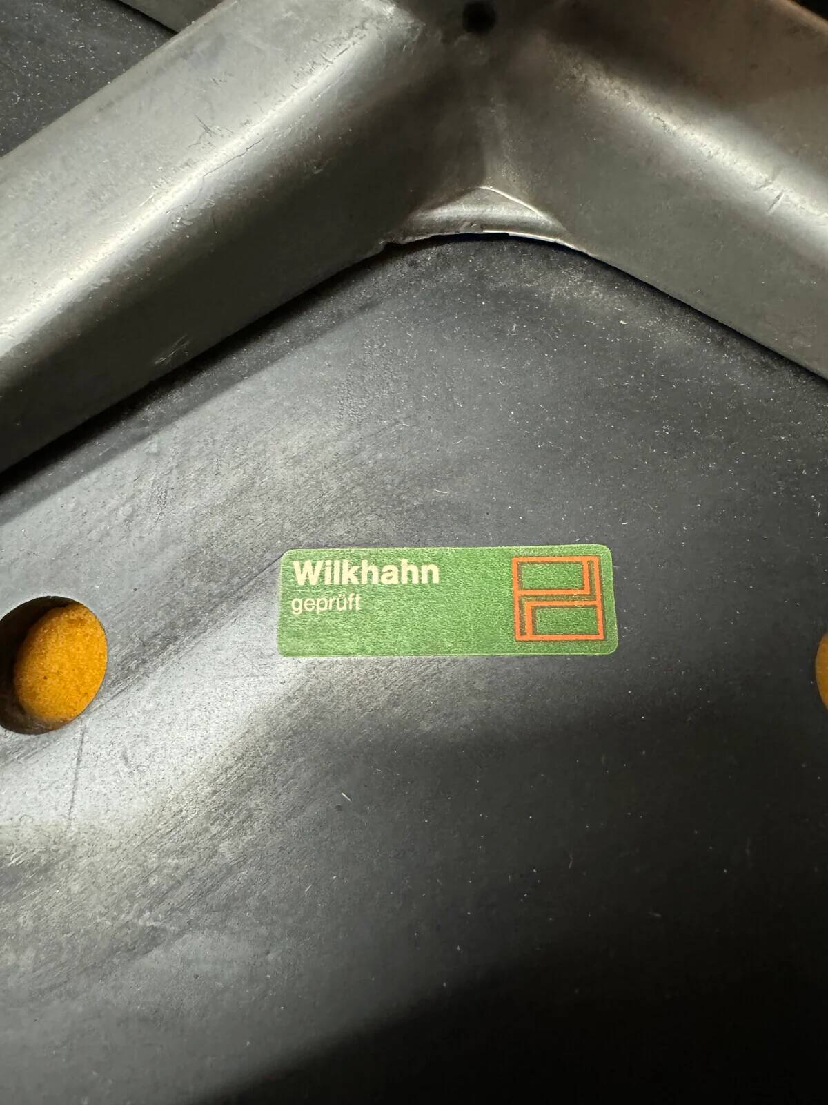 Wilkhahn Delta lounge chair in black leather with polished aluminum base and footrest (1970s)