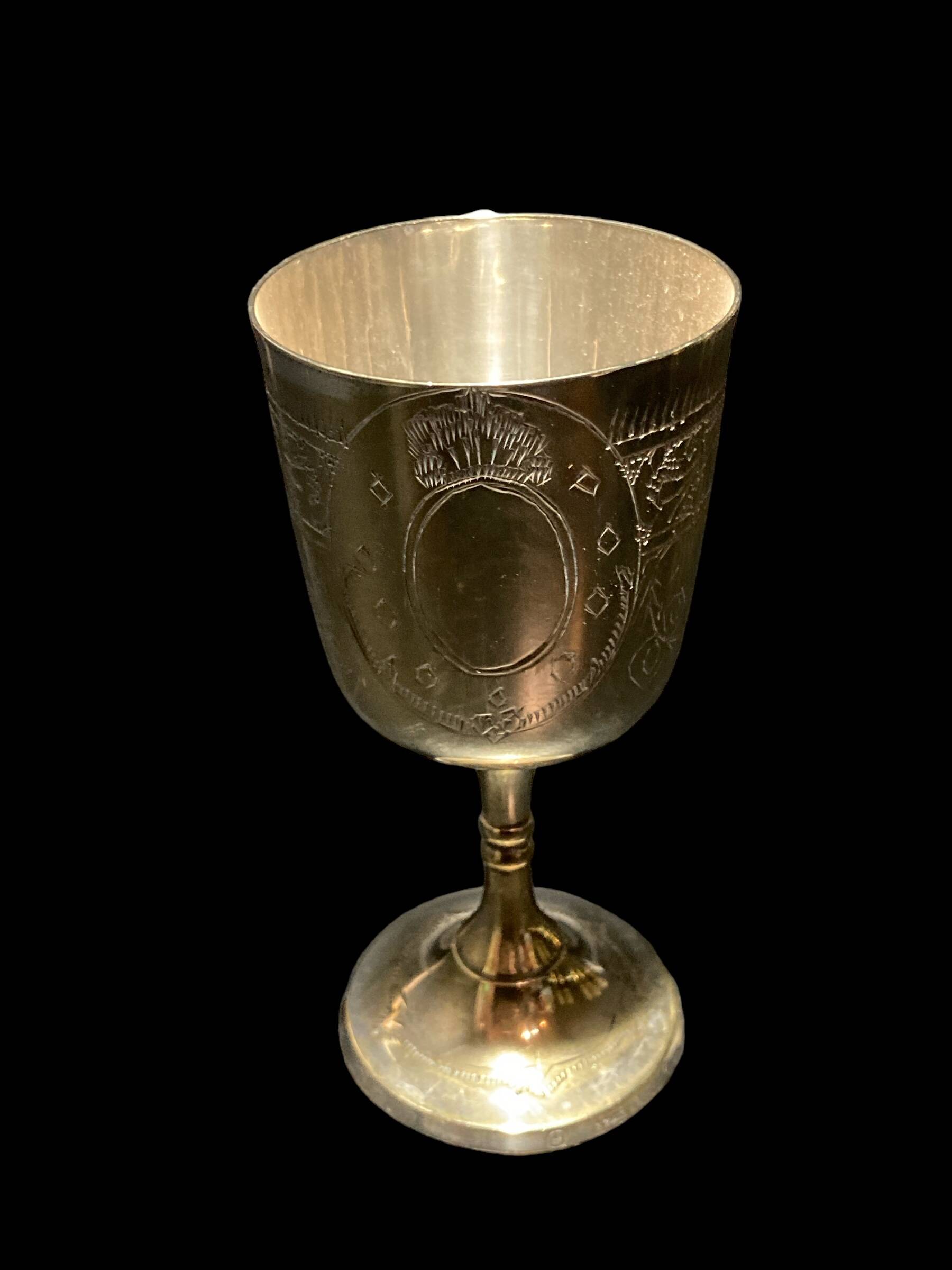 Set of six gold metal glasses
