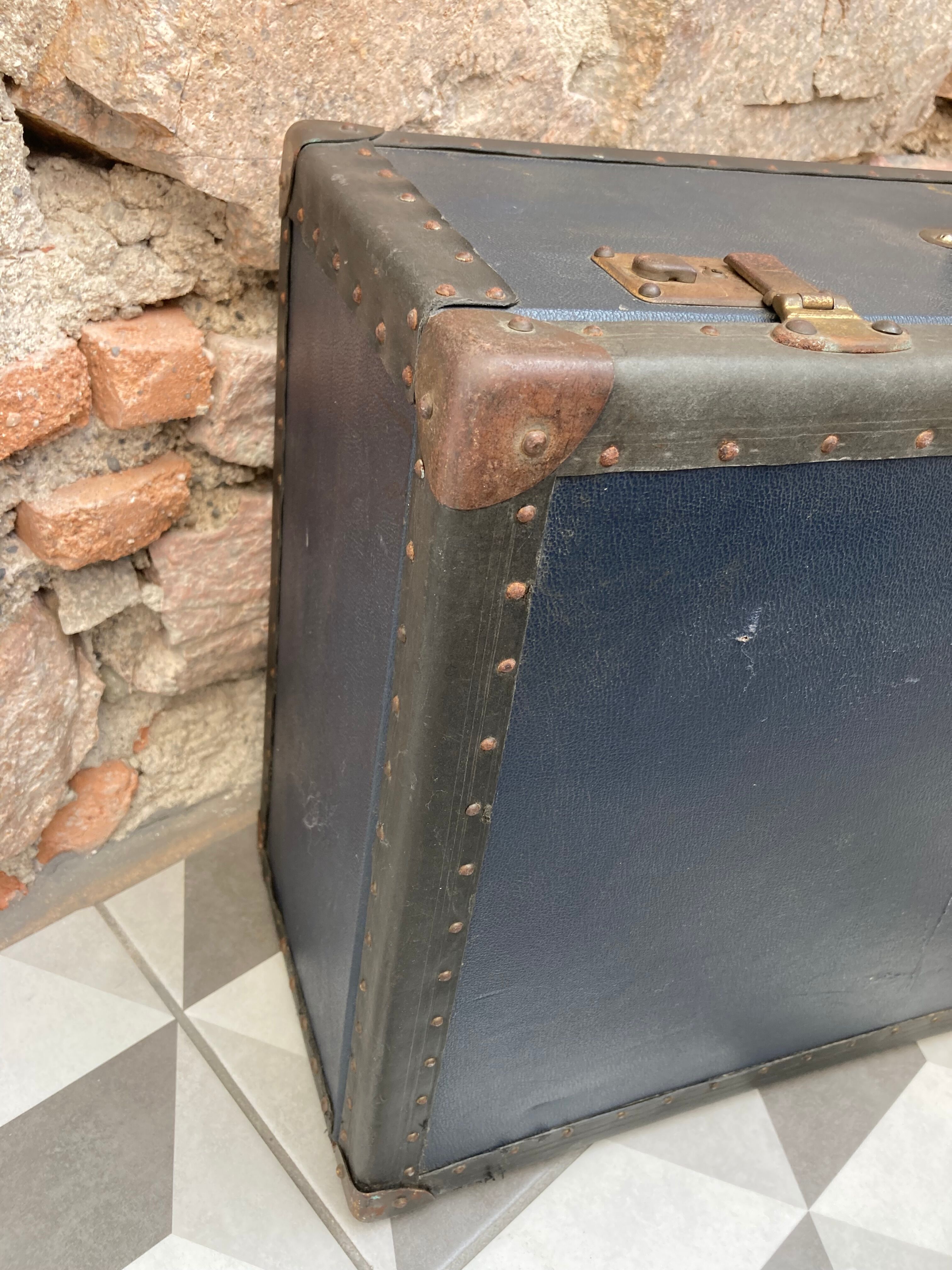 Midnight blue suitcase of representative 30s