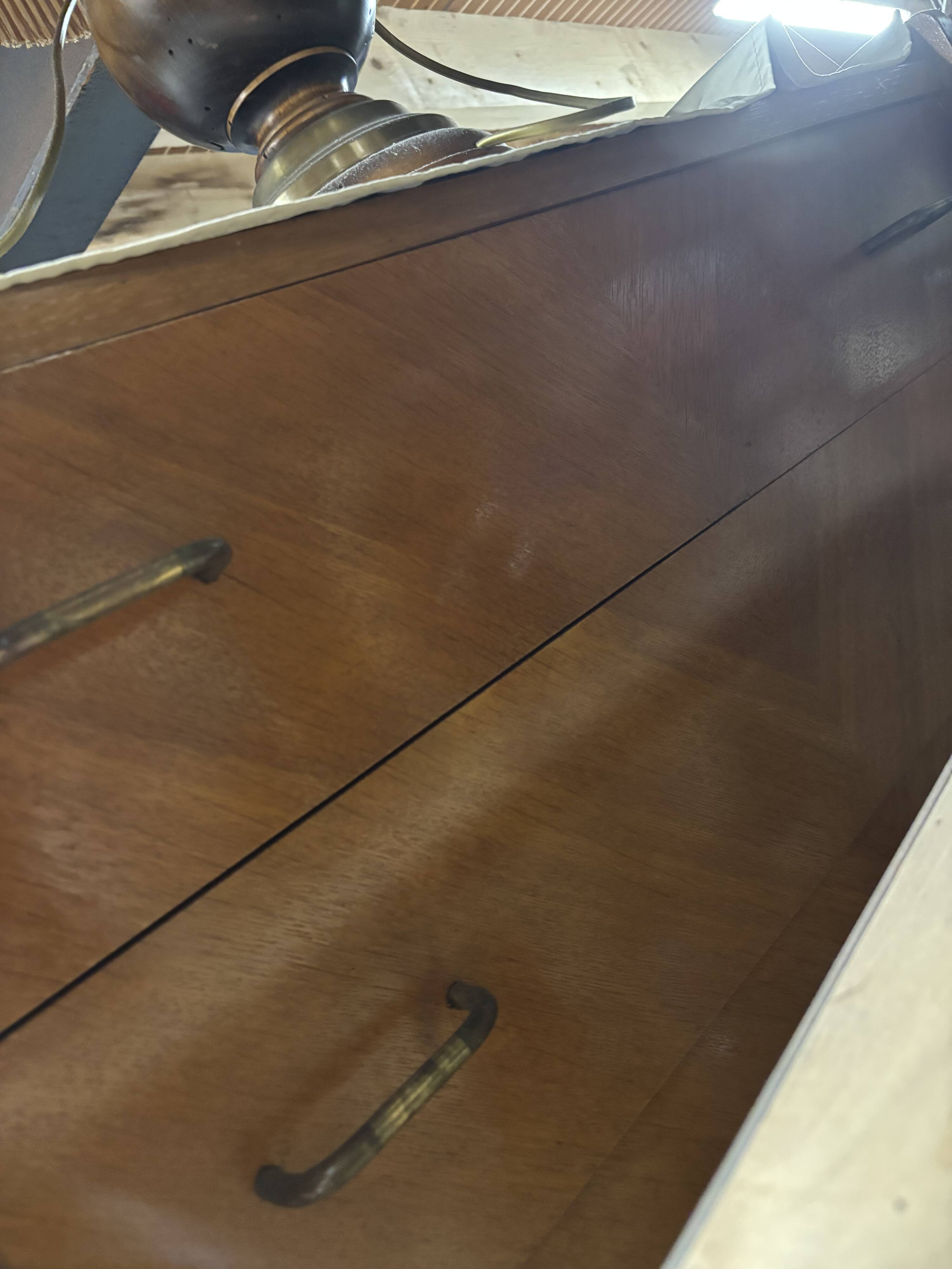 Vintage chest of drawers with compass feet.