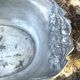 Footed pewter champagne cooler on claw feet with floral relief
