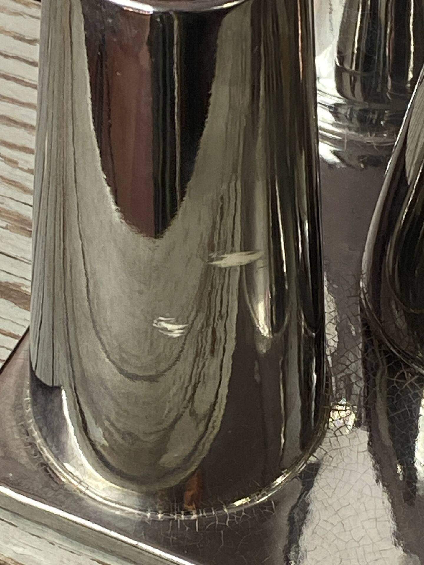 Asymmetrical multitube vase on a base, in silvered ceramic, 1970.