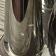 Asymmetrical multitube vase on a base, in silvered ceramic, 1970.