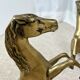 Hollywood Regency style coffee table, 6 patinated brass horses and glass top, 1970.