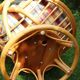 Swivel rattan armchair with matching ottoman