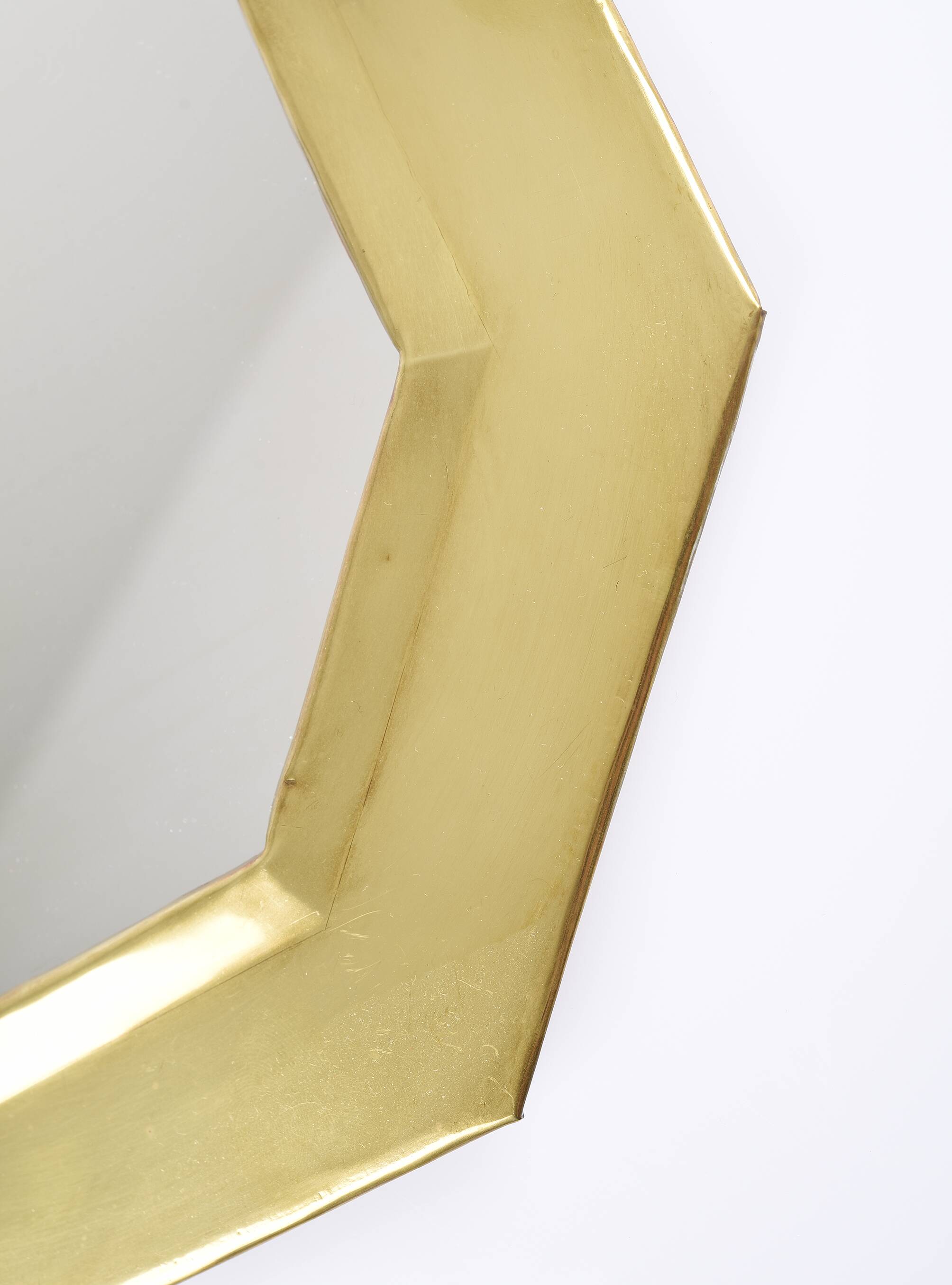Old golden octagonal mirror, in brass