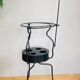 Foldable wrought iron support from the 19th century for a toilet set.