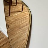 Asymmetrical brass mirror