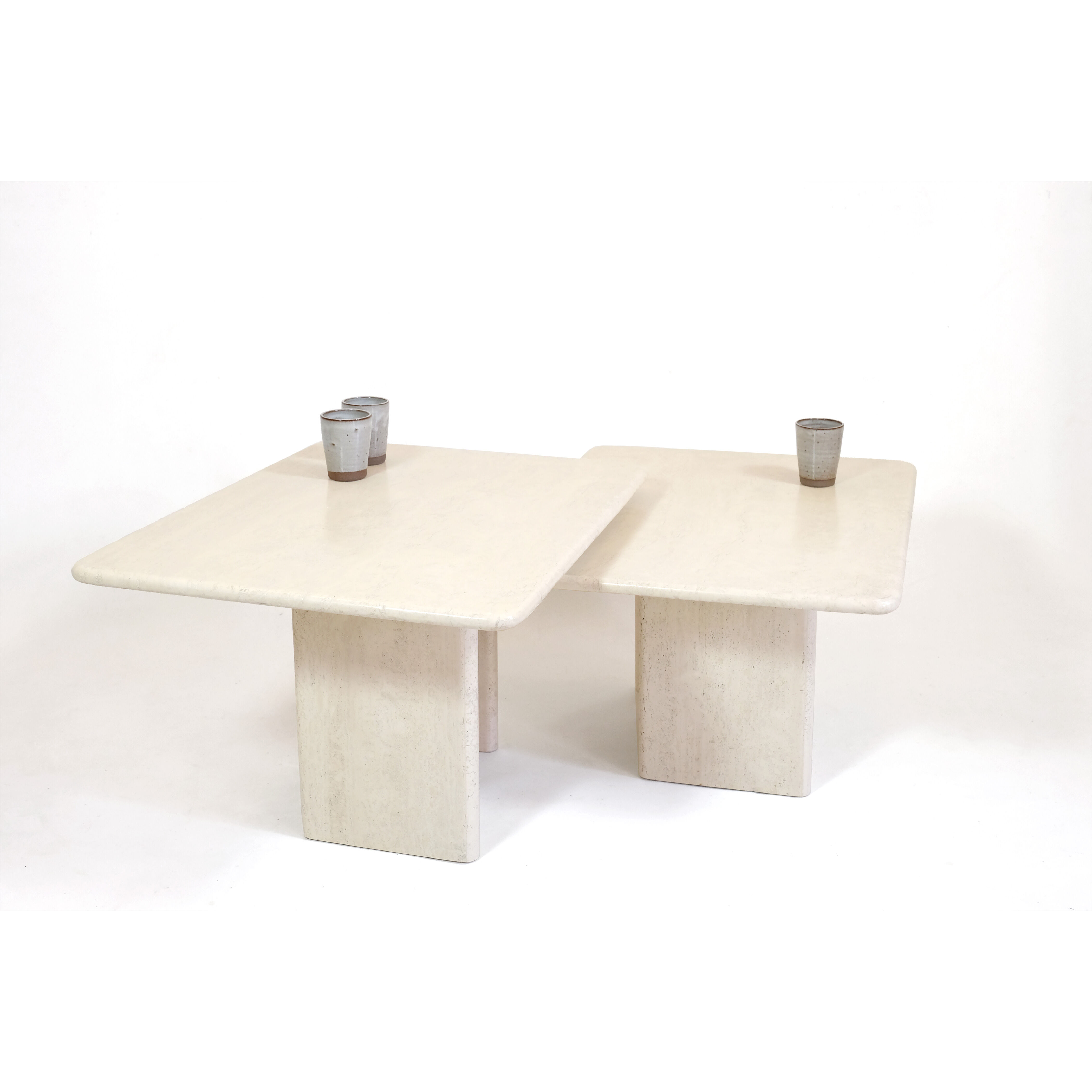 Pair of travertine trundle tables, Italy