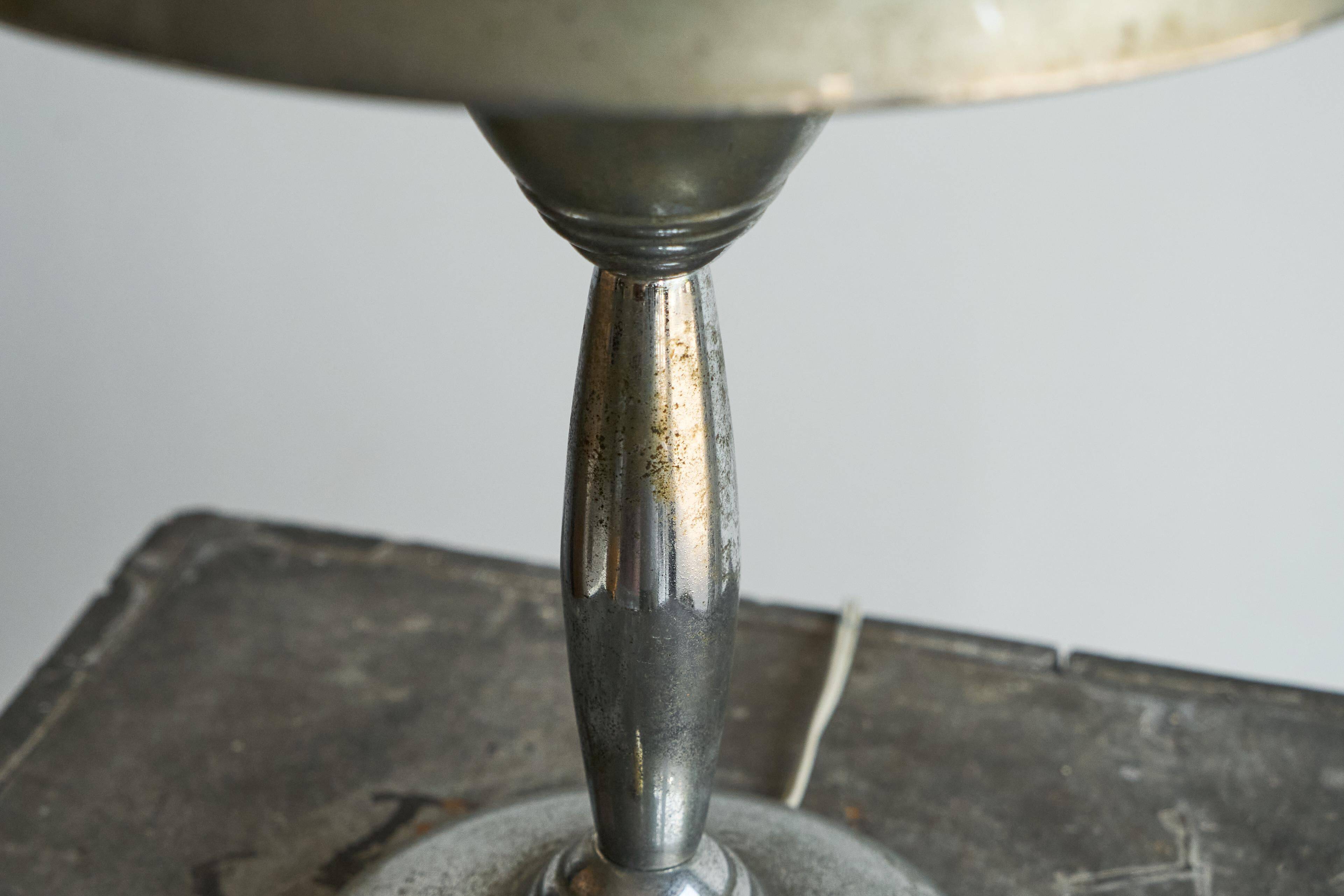 Patinated brass and chrome table lamp from the 1950s.