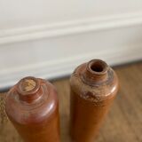 Duo of bottles in ancient sandstone