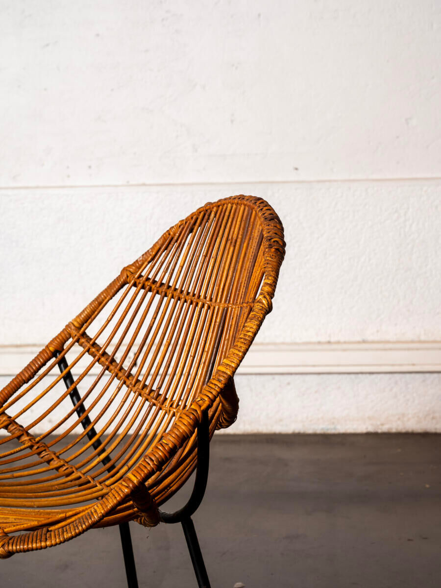 Rattan armchair with metal legs