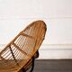 Rattan armchair with metal legs