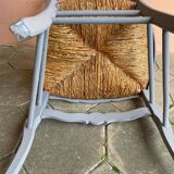 Provencal style straw armchair with gray blue patina armrests