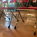 8 chaises pliantes en velours rouge