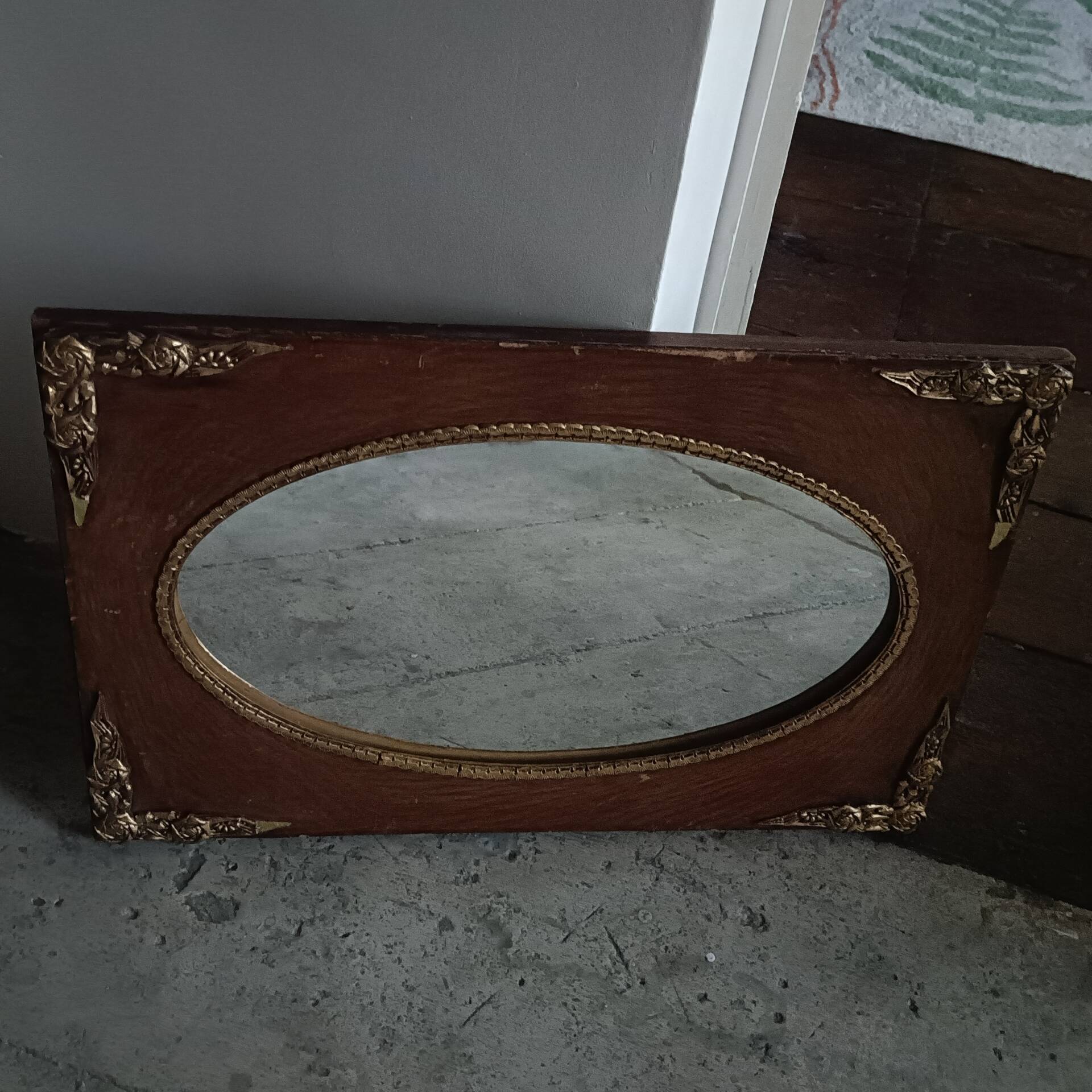 Oval and gold Art Deco mirror