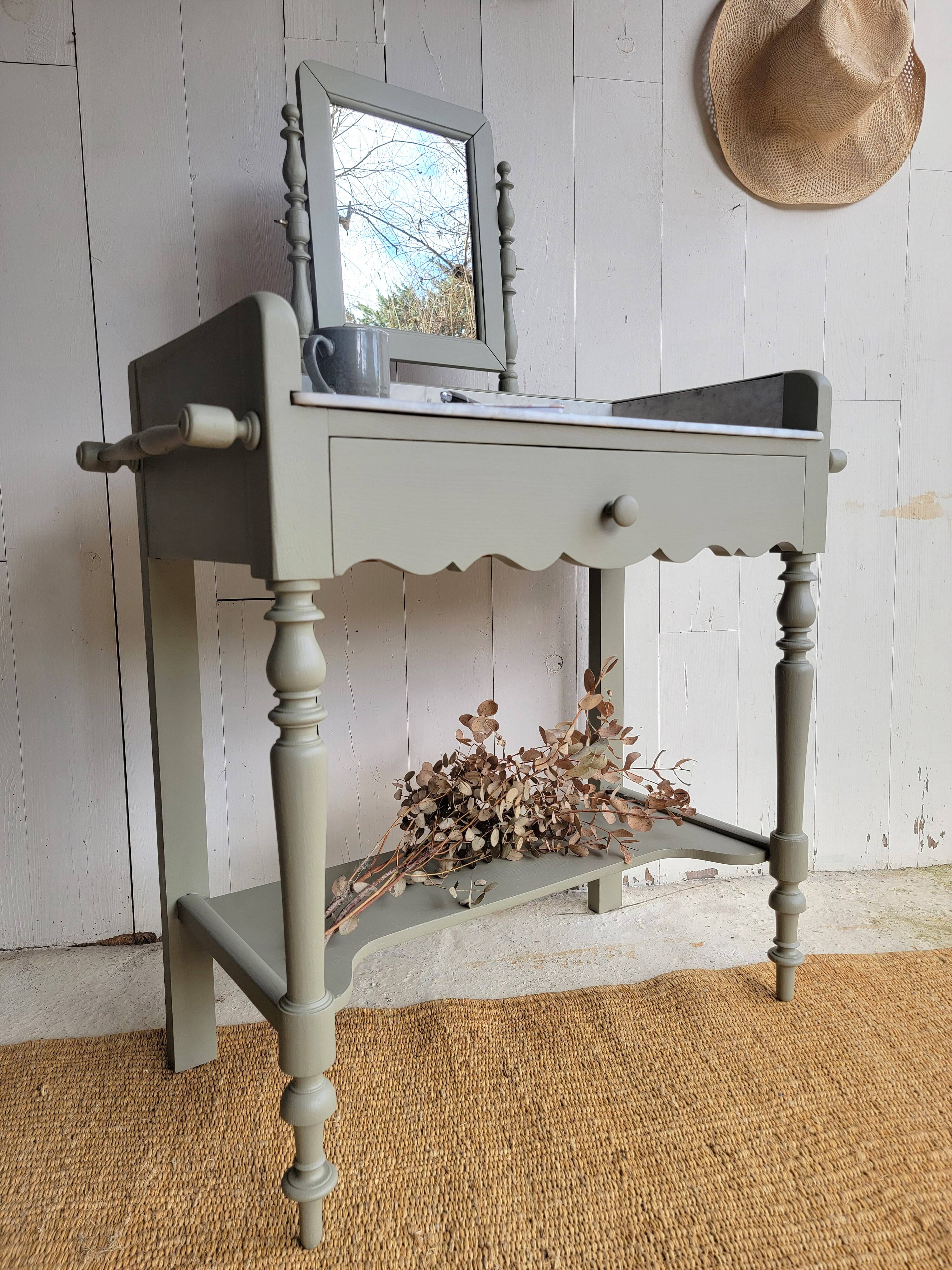 Antique wooden dressing table with marble top and mirror.