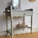 Antique wooden dressing table with marble top and mirror.