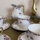 18-piece porcelain coffee set signed "Aux Lions de Faïence Paris"
