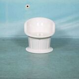 Space-age shell chair with storage, Ikea Popptorp chair.