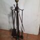 Antique fireplace set in solid wrought iron and brass.