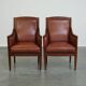 Majestic, luxurious set of 4 cognac-colored cowhide leather Art Deco design armchairs