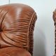 2 fauteuils en cuir cognac, années 1970