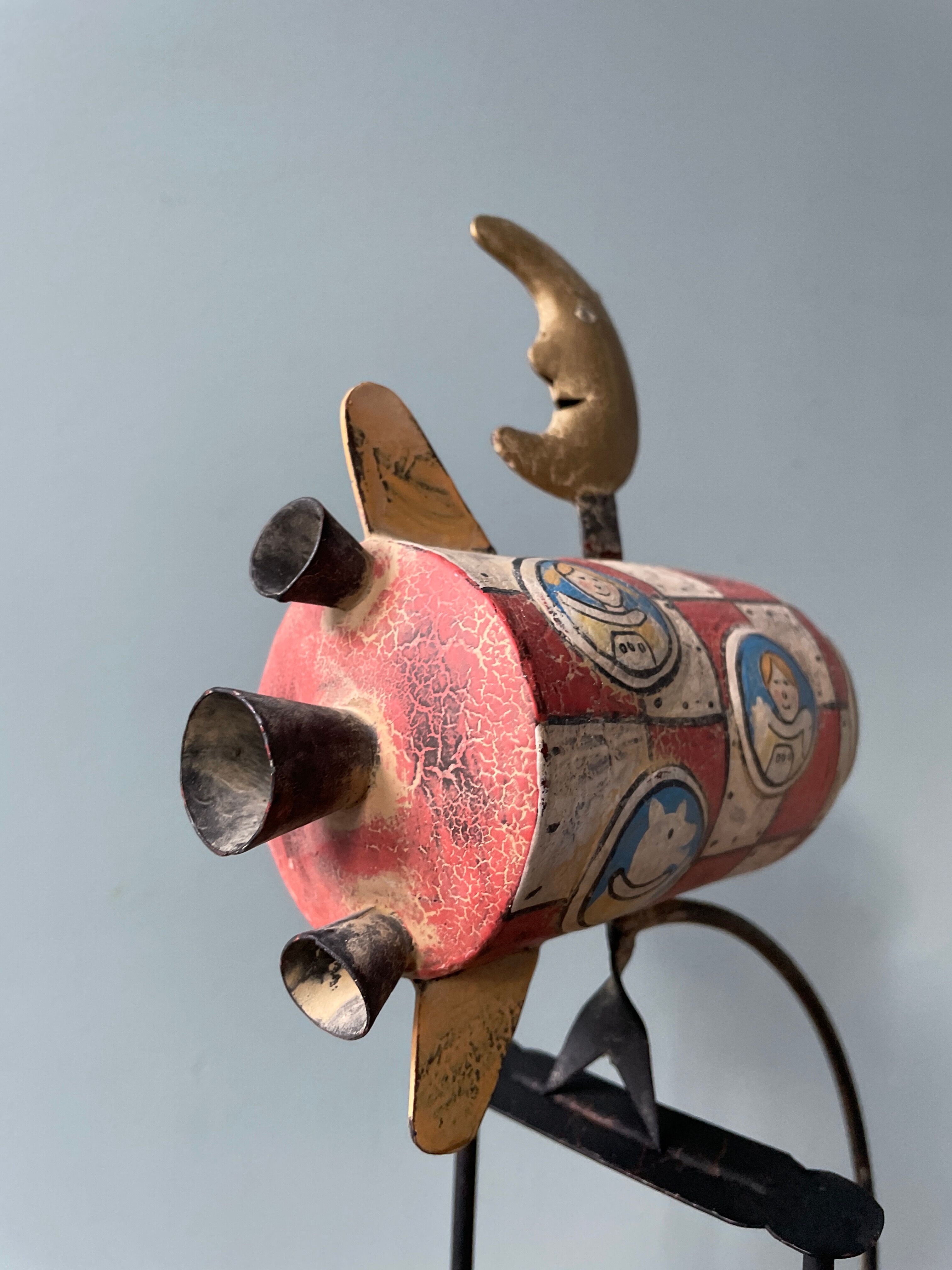 Old painted sheet metal pendulum toy