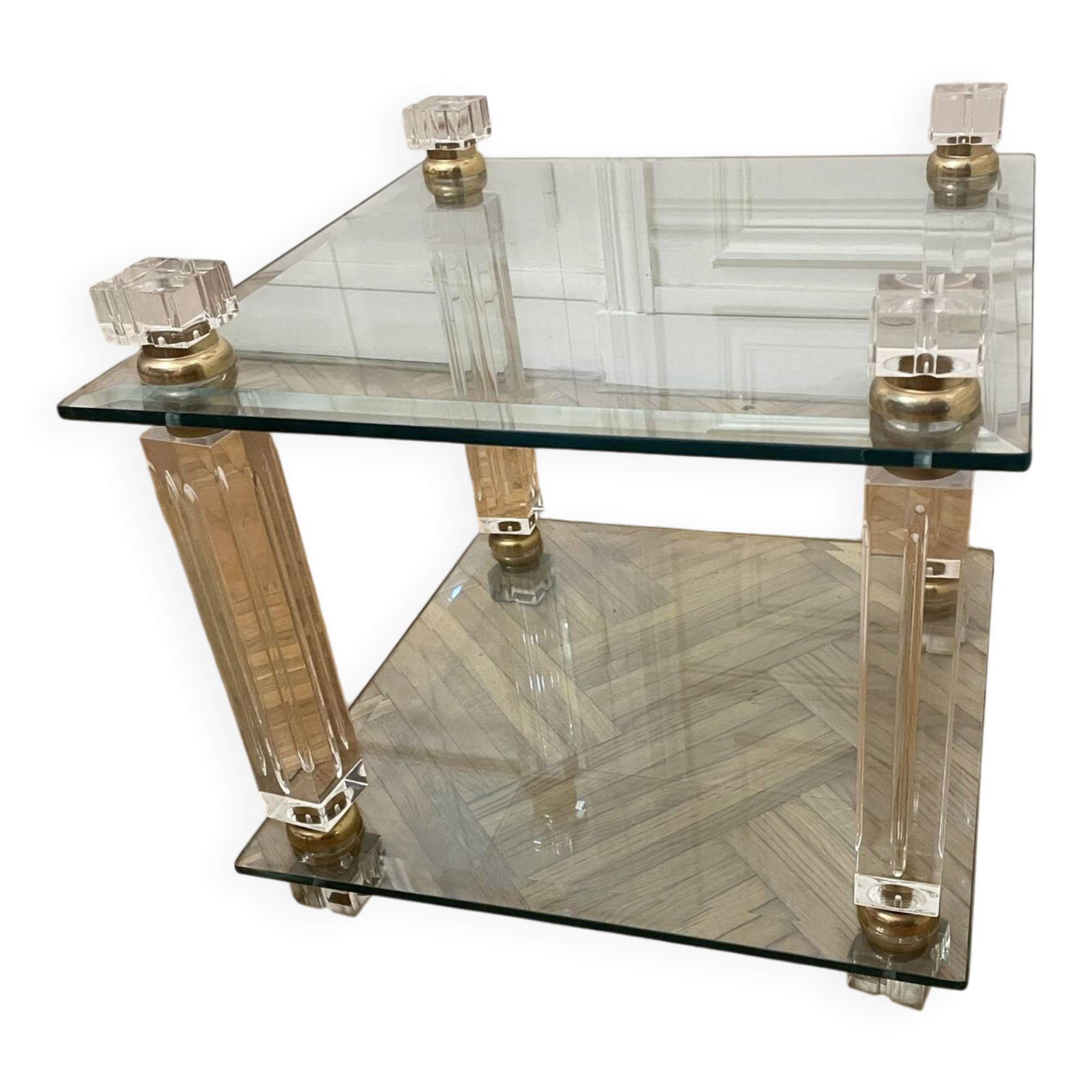 Glass side table with gold decorations.