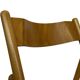 Chaise pliante vintage en bois avec assise en rotin design minimaliste des années 80