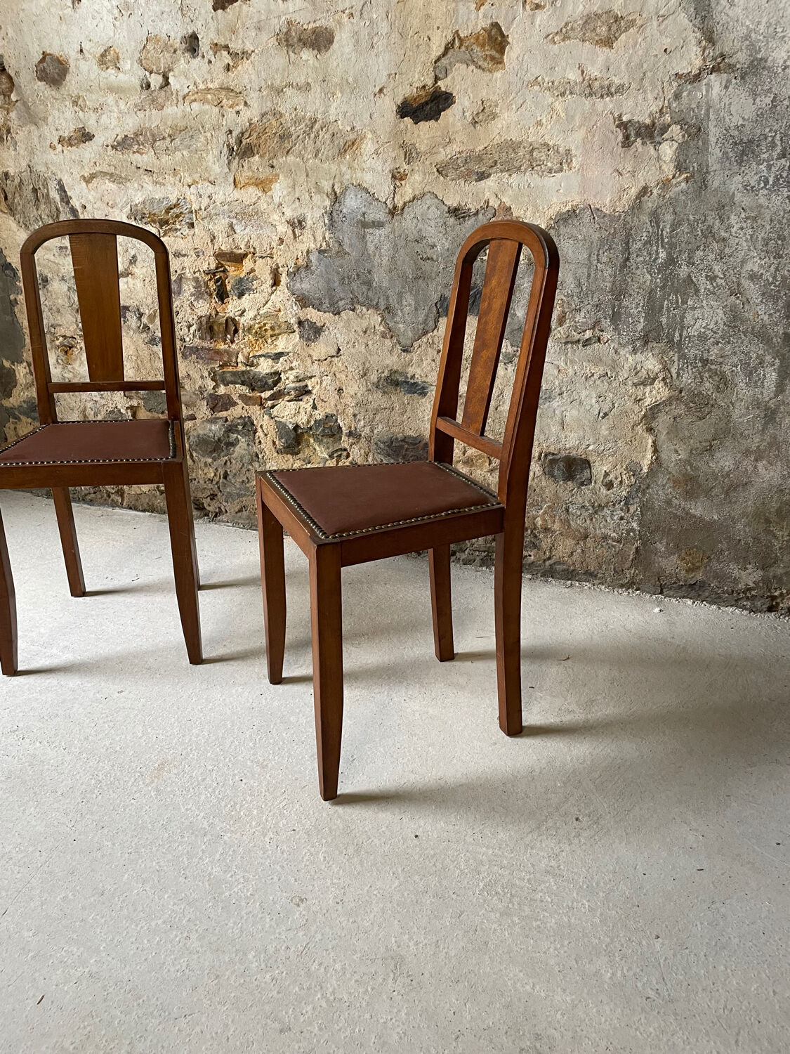 Set of 2 wooden chairs with studded leather.