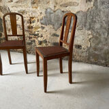 Set of 2 wooden chairs with studded leather.