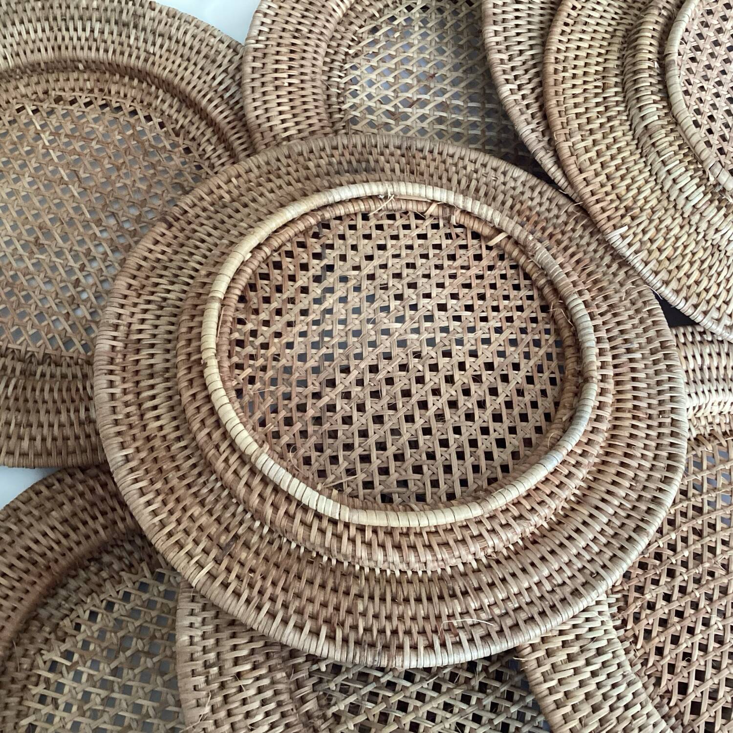 Set of round woven rattan and canework coasters