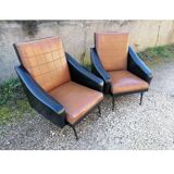 Paire de fauteuils en simili cuir
