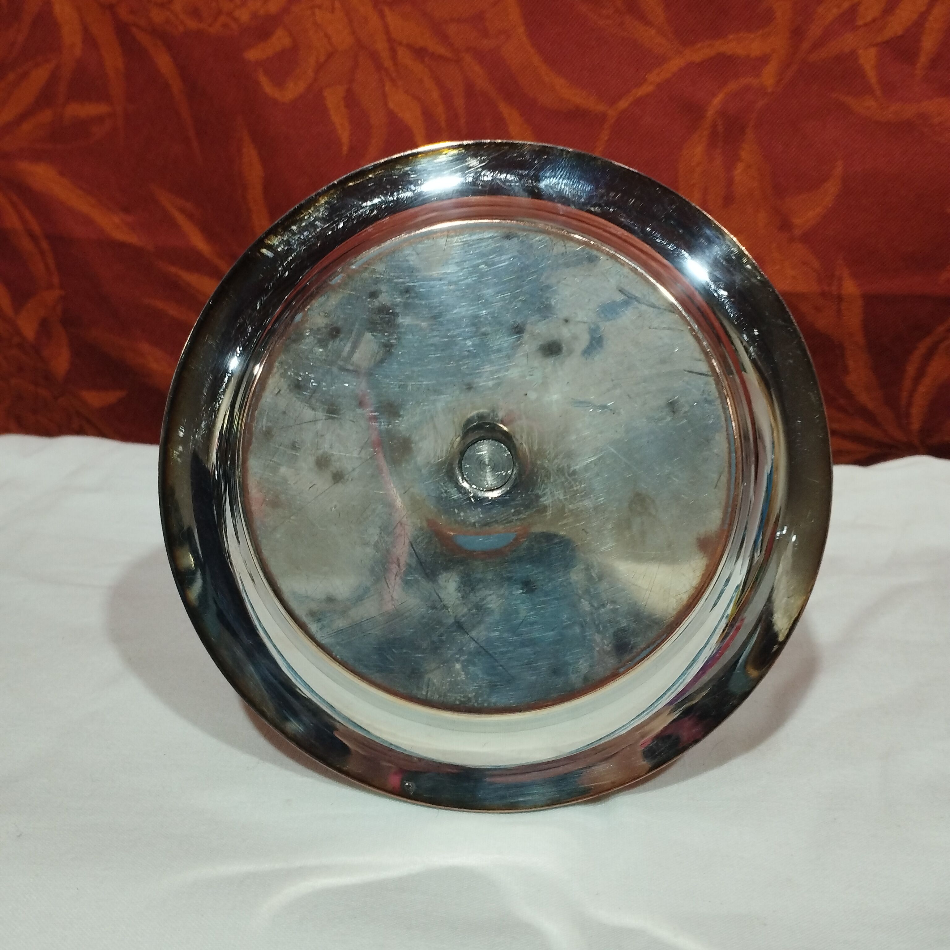 Old silver metal cockerel with its saucer