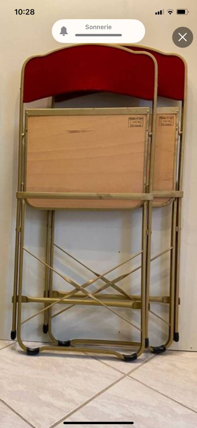 2 metal and red velvet chairs