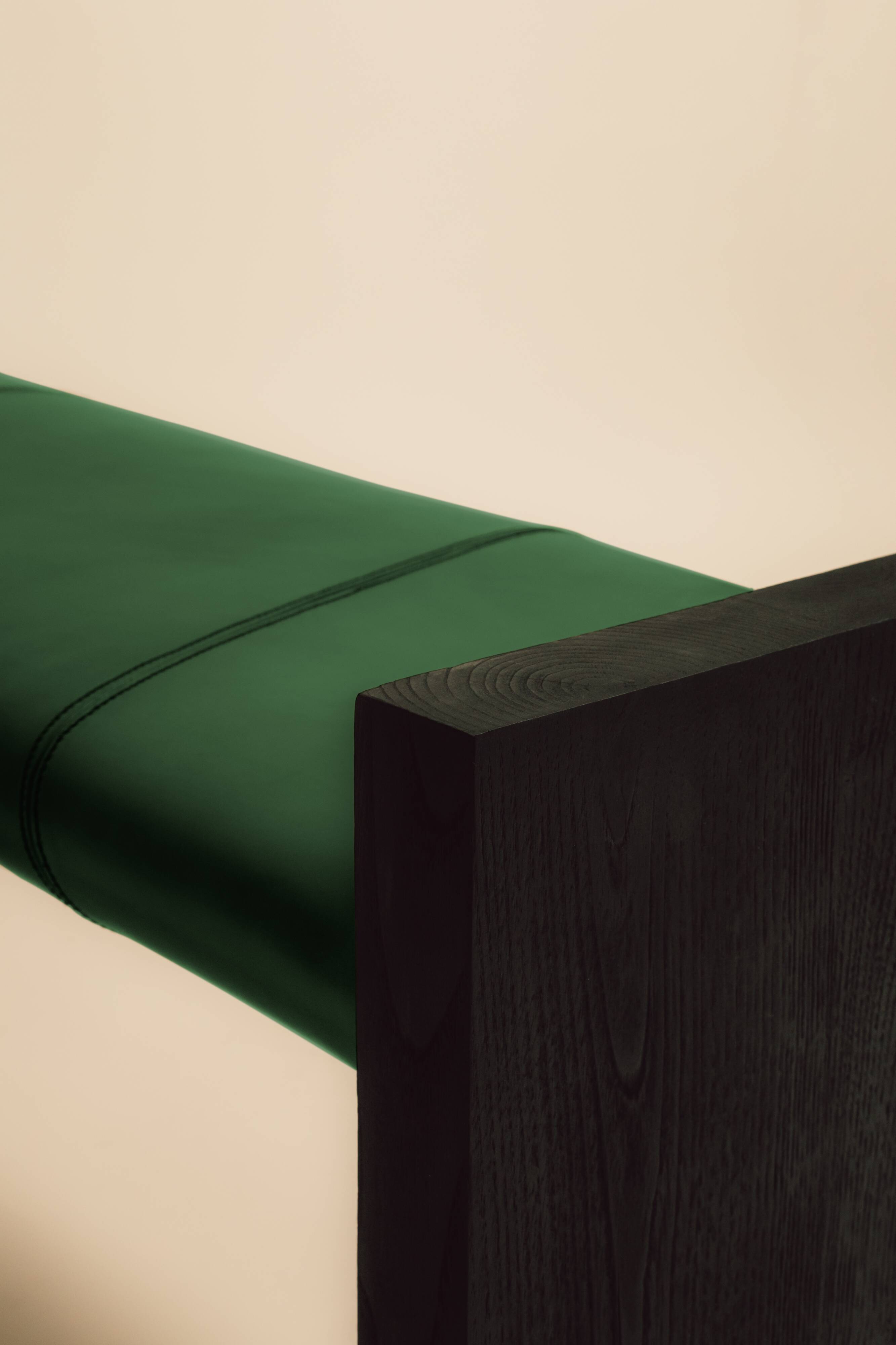 Maërl bench, sepia model, ebonized chestnut and green leather