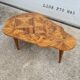 Vintage art deco coffee table with geometric marquetry