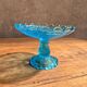 Blue glass footed fruit bowl.