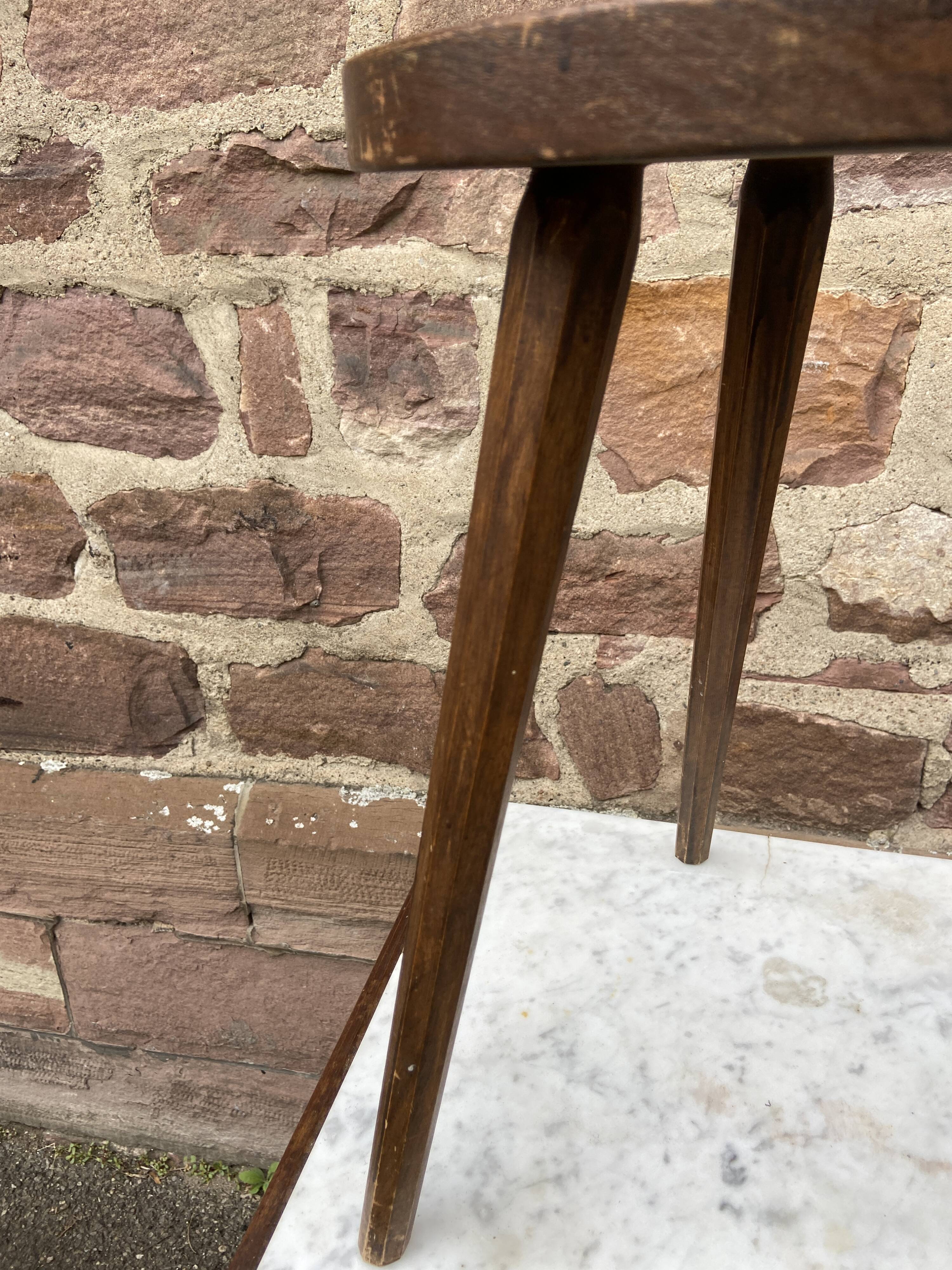 Brutalist rustic tripod farm stool made of vintage wood