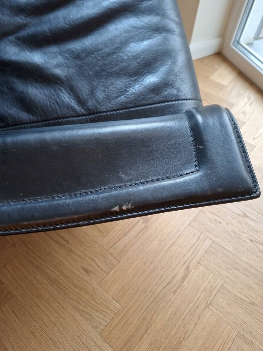 Small vintage black faux leather sofa