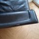 Small vintage black faux leather sofa