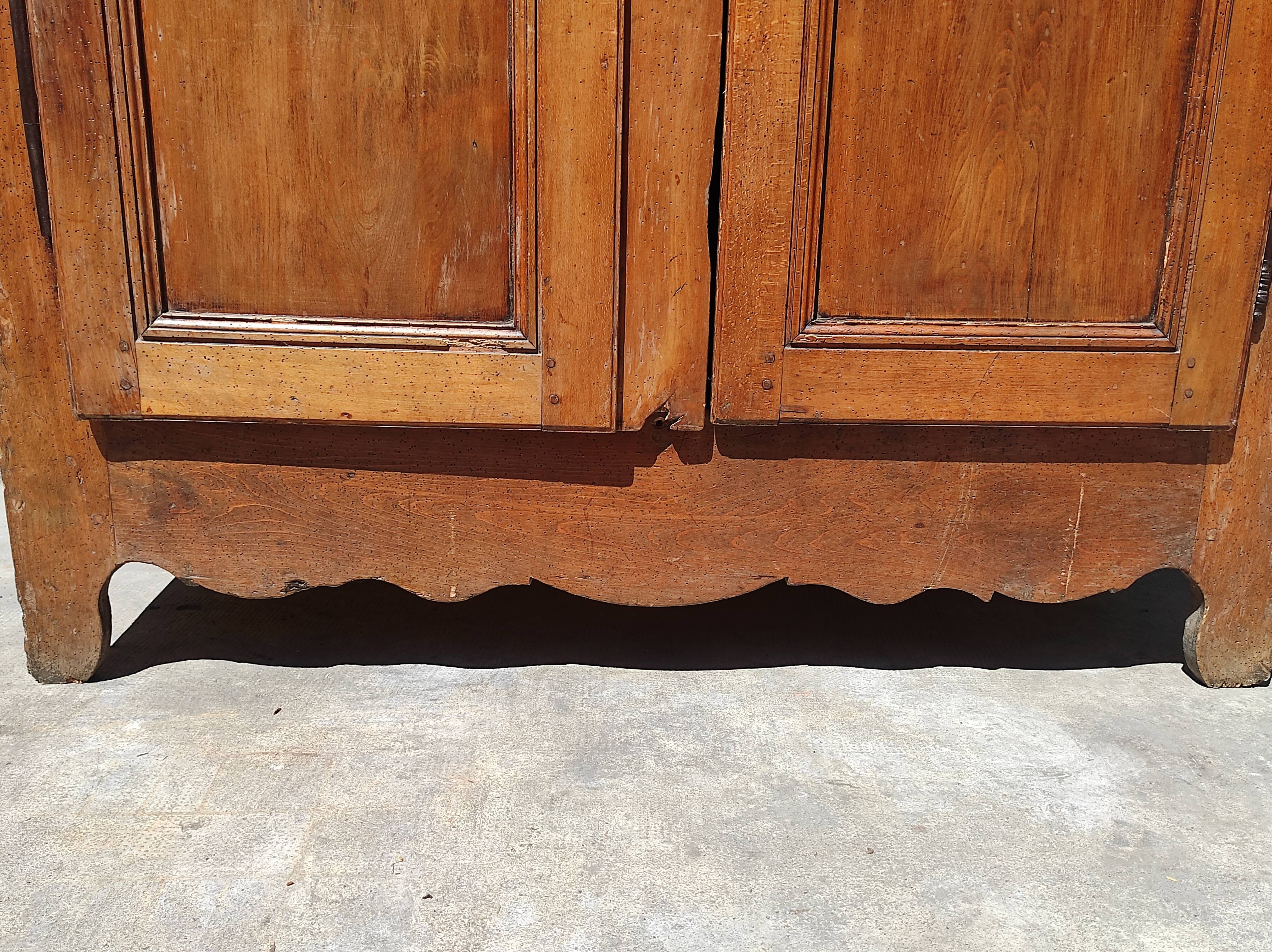 Old rustic oak cabinet of the 19th century louis 15 style