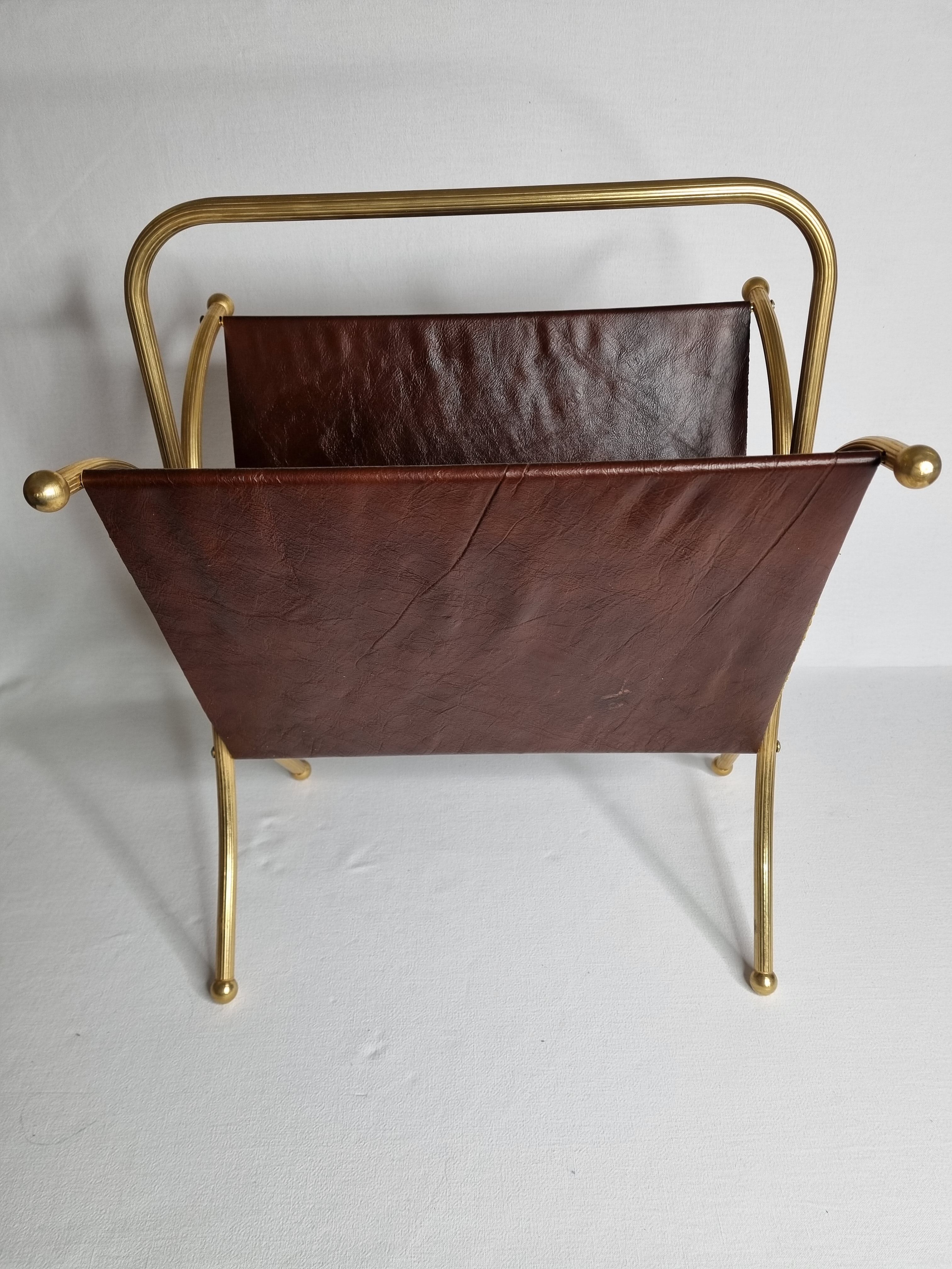Vintage magazines and gold and leather brass