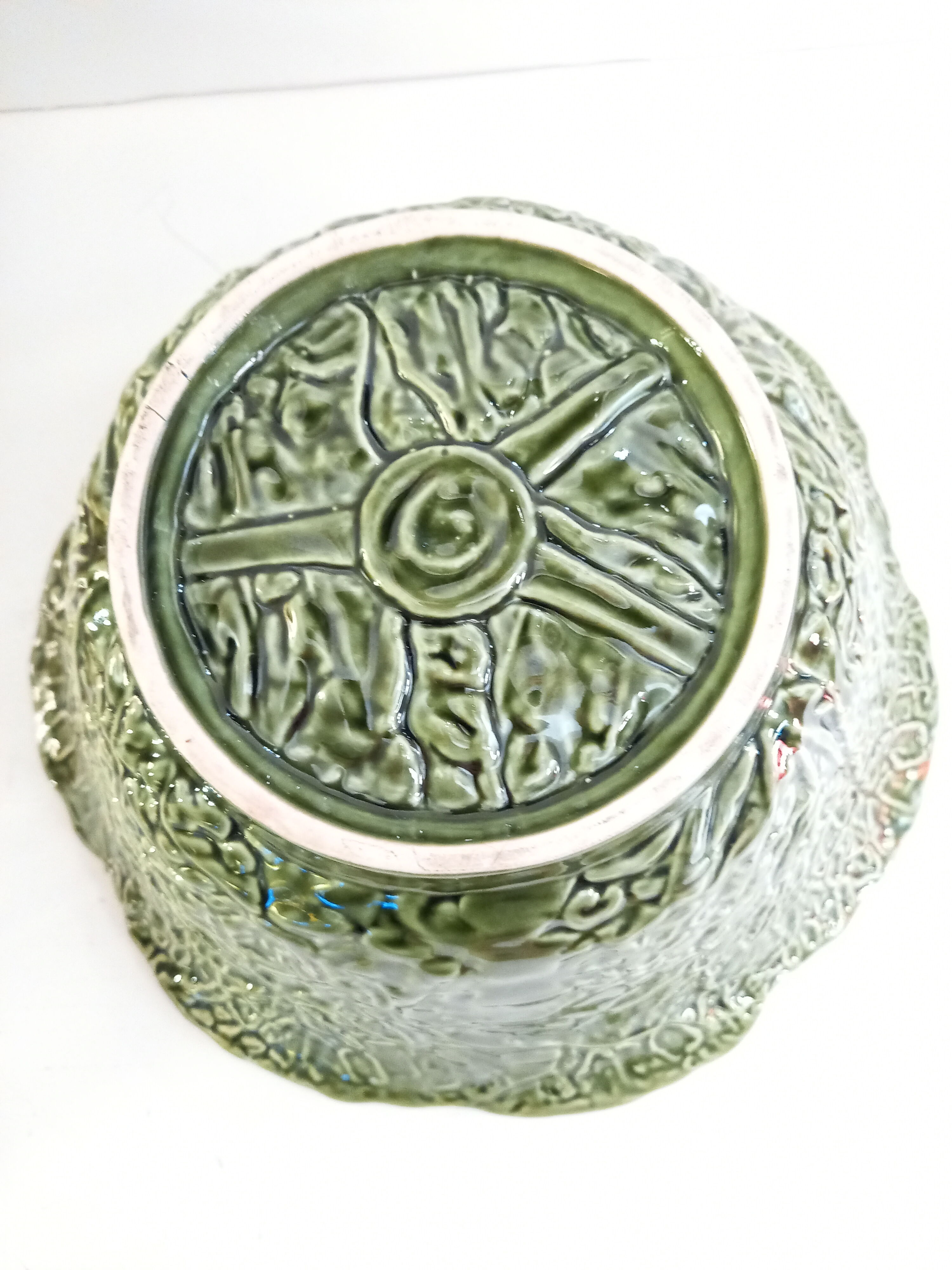 Vintage salad bowl in dabbling cabbage leaf and cutlery
